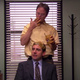 Screenshot from "The Office" Dwight covers Michael's hair in peanut butter